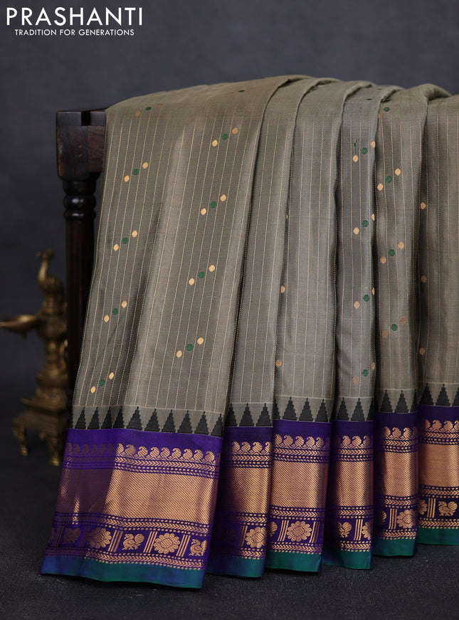 Pure gadwal silk saree greyish green and blue with allover zari weaves & buttas and zari woven border