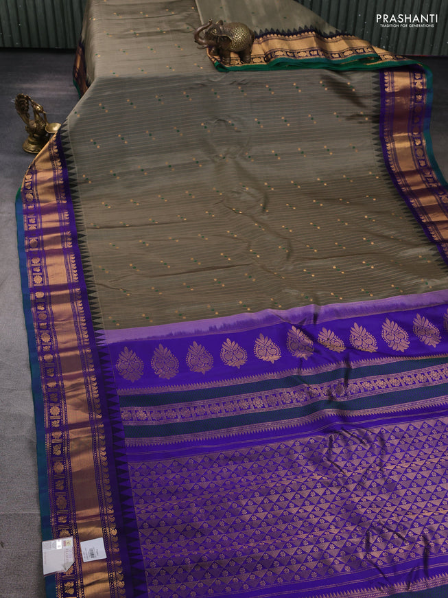 Pure gadwal silk saree greyish green and blue with allover zari weaves & buttas and zari woven border