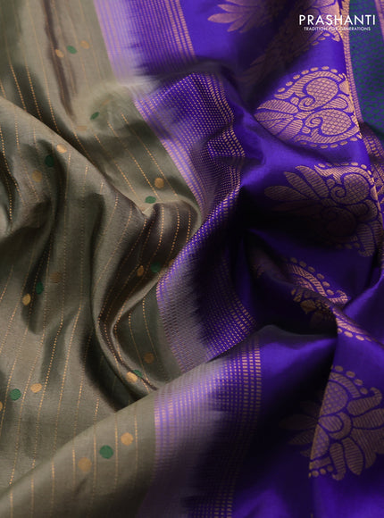 Pure gadwal silk saree greyish green and blue with allover zari weaves & buttas and zari woven border