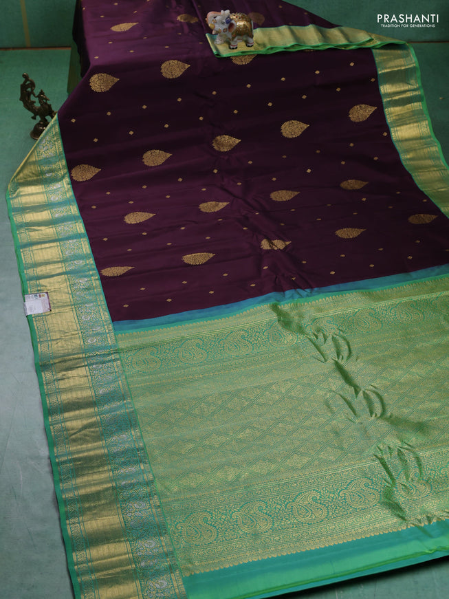 Pure gadwal silk saree deep jamun and green shade with zari woven buttas and zari woven border
