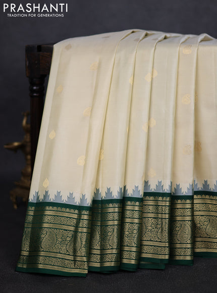 Pure gadwal silk saree off white and green with paisley zari woven buttas and temple design zari woven border