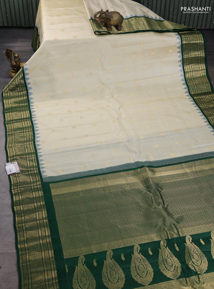 Pure gadwal silk saree off white and green with paisley zari woven buttas and temple design zari woven border