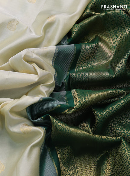 Pure gadwal silk saree off white and green with paisley zari woven buttas and temple design zari woven border