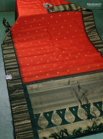 Pure gadwal silk saree orange and bottle green with paisley zari woven buttas and temple design zari woven border