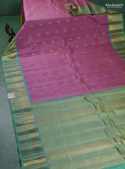 Pure gadwal silk saree pastel pink and green shade with paisley zari woven buttas and temple design zari woven border
