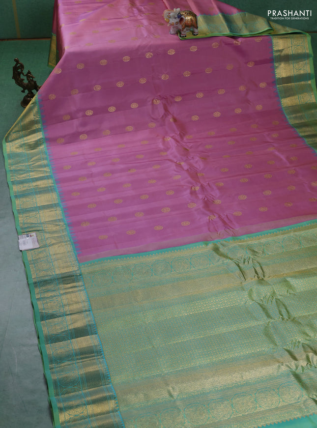 Pure gadwal silk saree pastel pink and green shade with paisley zari woven buttas and temple design zari woven border