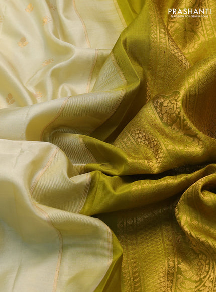 Pure gadwal silk saree cream and mehendi green with zari woven buttas and temple design zari woven border