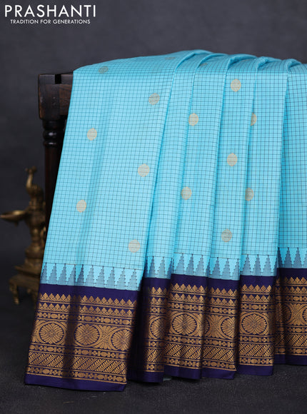 Pure gadwal silk saree light blue and navy blue with allover checks & buttas and temple design zari woven border