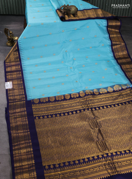 Pure gadwal silk saree light blue and navy blue with allover checks & buttas and temple design zari woven border