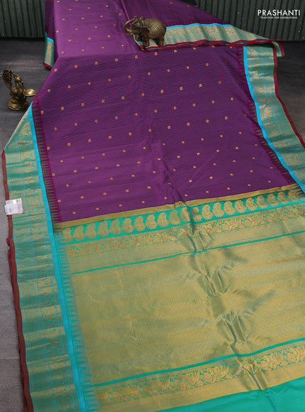 Pure gadwal silk saree purple and teal green with allover checks & buttas and temple design zari woven border