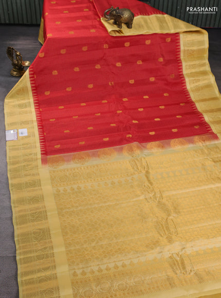 Pure gadwal silk saree red and pale yellow with allover checks & buttas and temple design zari woven border