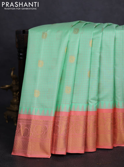 Pure gadwal silk saree pista green and peach orange with allover checks & buttas and temple design zari woven border