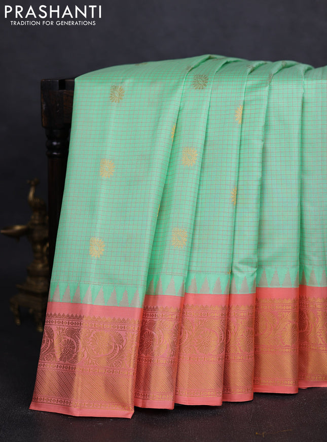 Pure gadwal silk saree pista green and peach orange with allover checks & buttas and temple design zari woven border