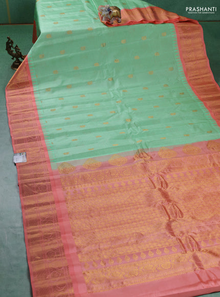 Pure gadwal silk saree pista green and peach orange with allover checks & buttas and temple design zari woven border