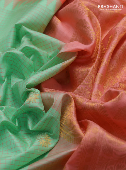 Pure gadwal silk saree pista green and peach orange with allover checks & buttas and temple design zari woven border