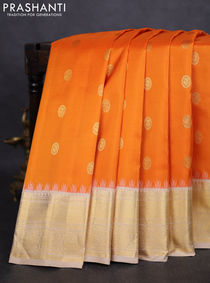 Pure gadwal silk saree orange and beige with zari woven buttas and temple design zari woven border