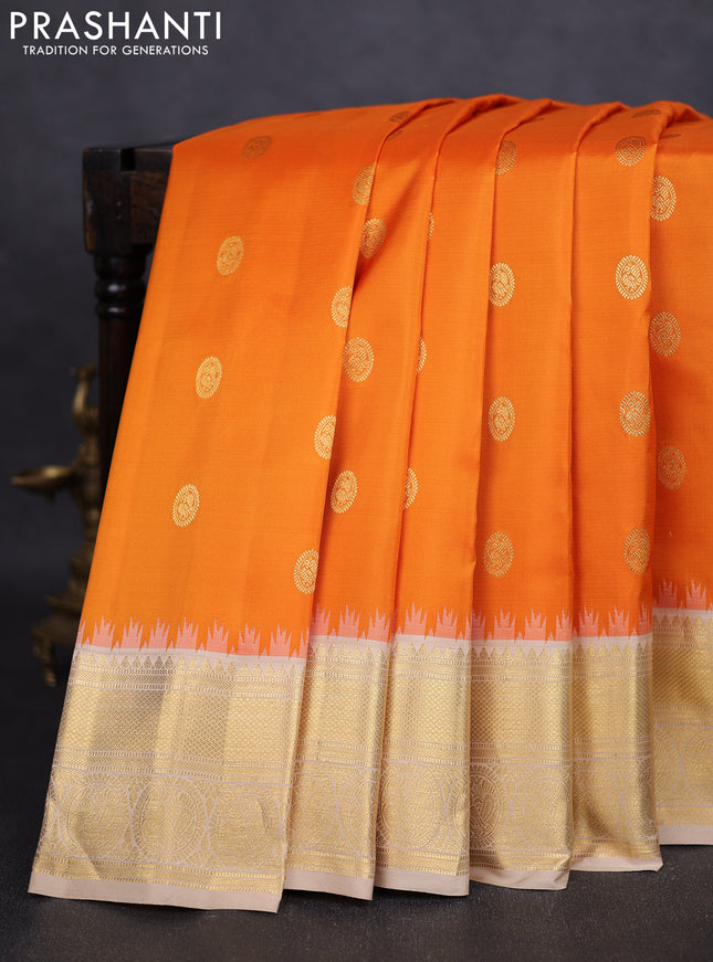 Pure gadwal silk saree orange and beige with zari woven buttas and temple design zari woven border