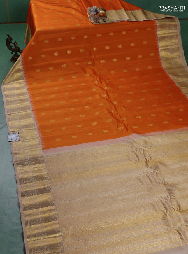 Pure gadwal silk saree orange and beige with zari woven buttas and temple design zari woven border