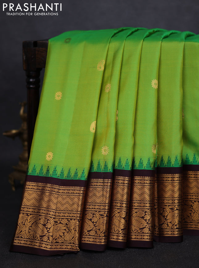 Pure gadwal silk saree light green and deep coffee brown with zari woven buttas and temple design zari woven border