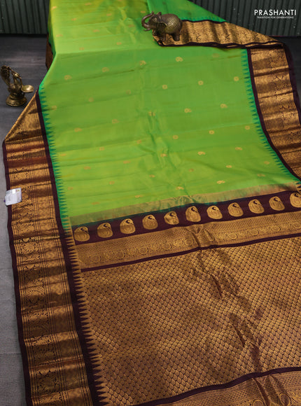 Pure gadwal silk saree light green and deep coffee brown with zari woven buttas and temple design zari woven border