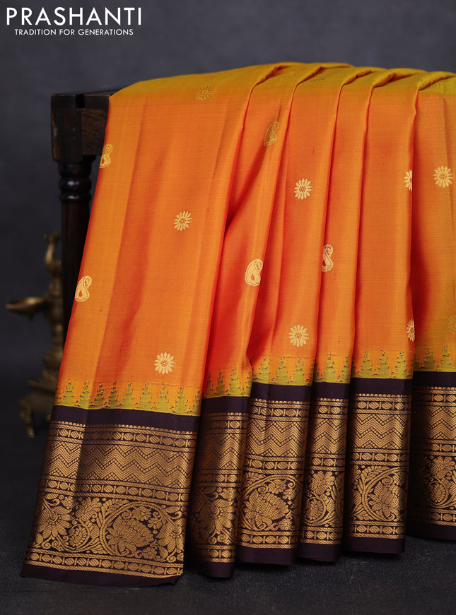 Pure gadwal silk saree mustard yellow and deep jamun with zari woven paisley buttas and temple design zari woven border