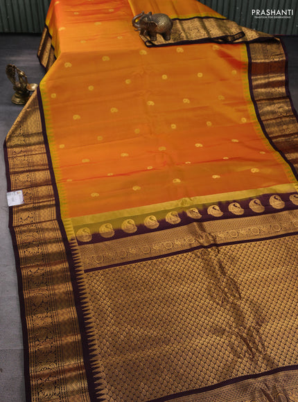 Pure gadwal silk saree mustard yellow and deep jamun with zari woven paisley buttas and temple design zari woven border