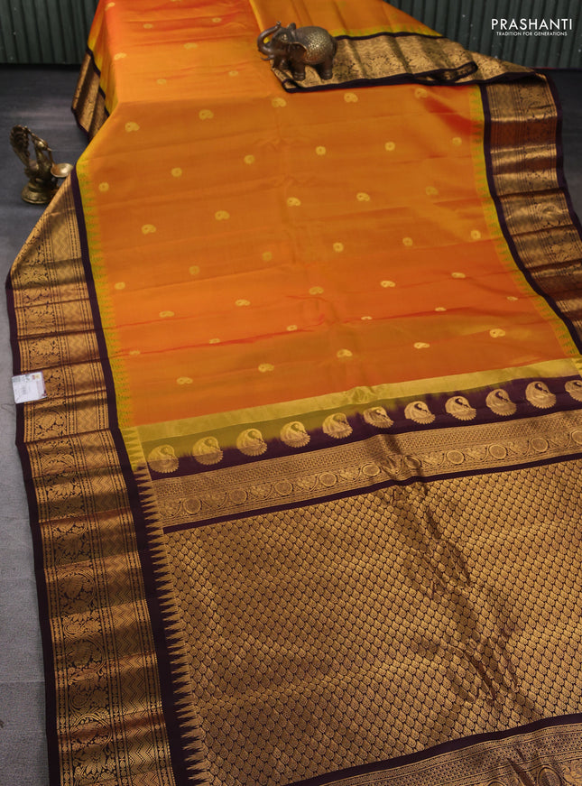 Pure gadwal silk saree mustard yellow and deep jamun with zari woven paisley buttas and temple design zari woven border