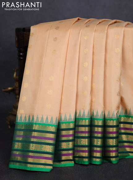 Pure gadwal silk saree beige and green with annam zari woven buttas and temple design zari woven border