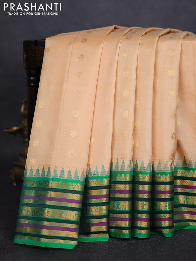 Pure gadwal silk saree beige and green with annam zari woven buttas and temple design zari woven border
