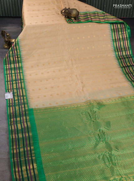 Pure gadwal silk saree beige and green with annam zari woven buttas and temple design zari woven border