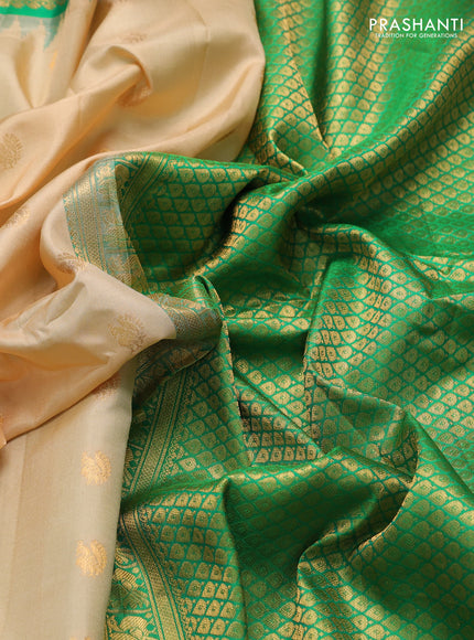 Pure gadwal silk saree beige and green with annam zari woven buttas and temple design zari woven border