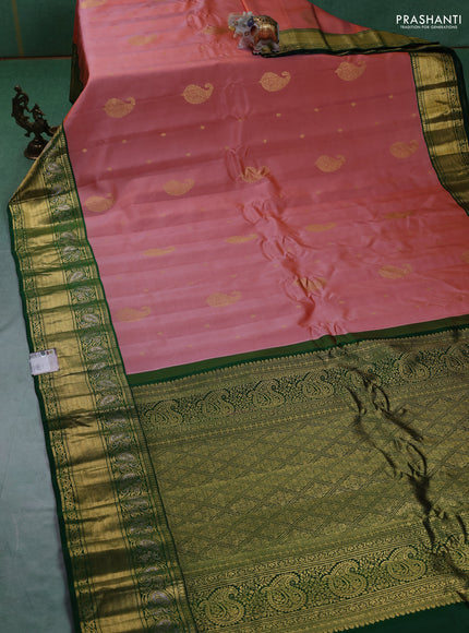 Pure gadwal silk saree rust shade and green with zari woven buttas and zari woven border