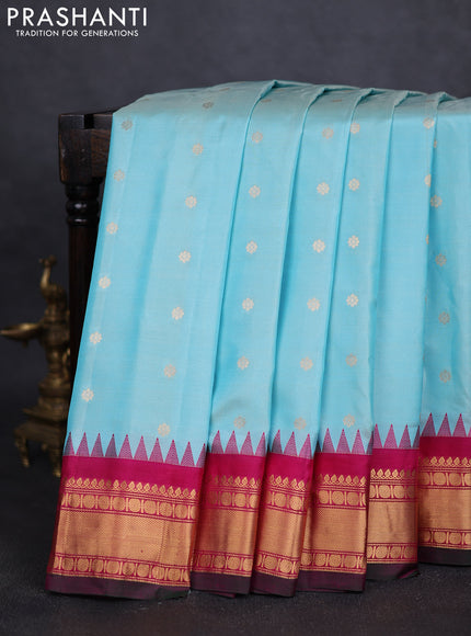 Pure gadwal silk saree pastel blue and pink with zari woven buttas and temple design zari woven border