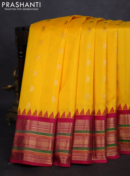 Pure gadwal silk saree yellow and pink with zari woven paisley buttas and temple design zari woven border