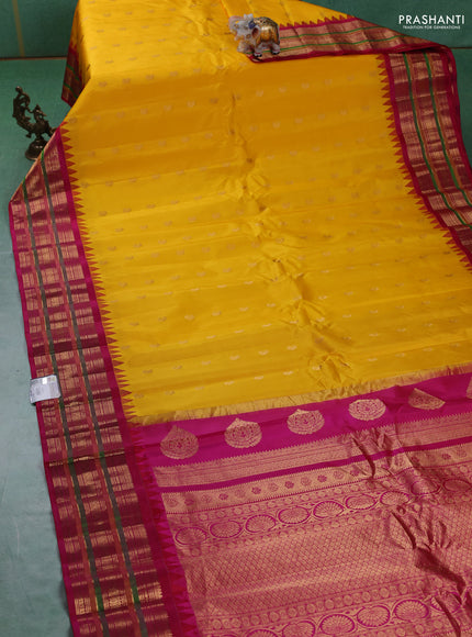 Pure gadwal silk saree yellow and pink with zari woven paisley buttas and temple design zari woven border
