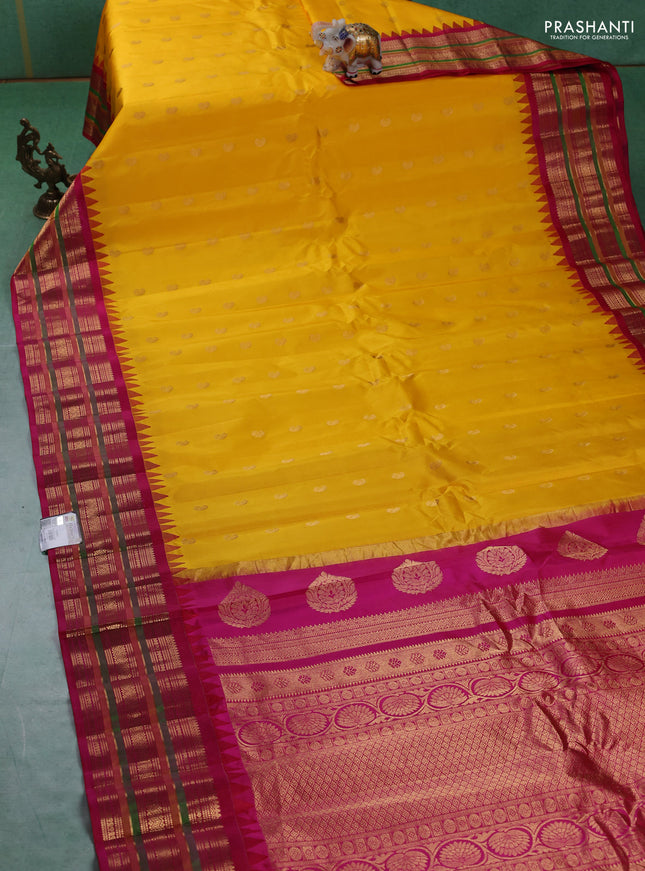 Pure gadwal silk saree yellow and pink with zari woven paisley buttas and temple design zari woven border