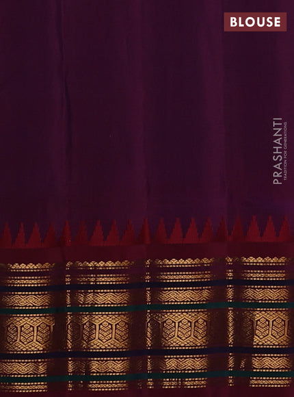 Pure gadwal silk saree dual shade of rust and dual shade of maroon with allover zari woven buttas and temple design zari woven border