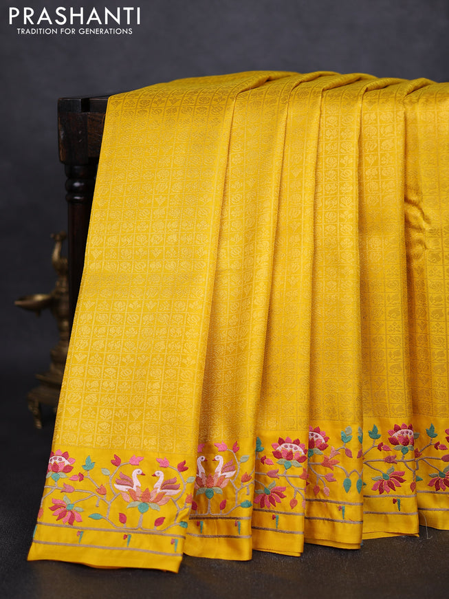 Pure kanchipuram silk saree yellow with allover zari checks & buttas and embroidery border