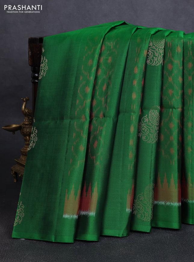 Ikat soft silk saree green and red with allover ikat weaves & zari buttas in borderless style