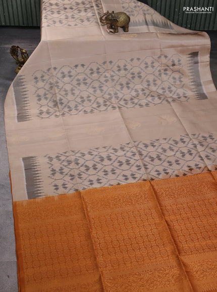 Ikat soft silk saree beige and dark mustard with allover ikat weaves & zari buttas in borderless style