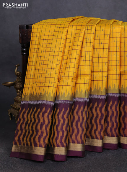 Ikat soft silk saree yellow and purple with allover checks & ikat buttas and long ikat woven zari border