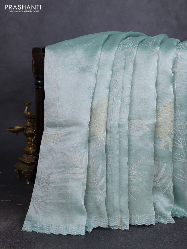Tissue silk saree teal green with allover pita embroidery work and simple embroidery border