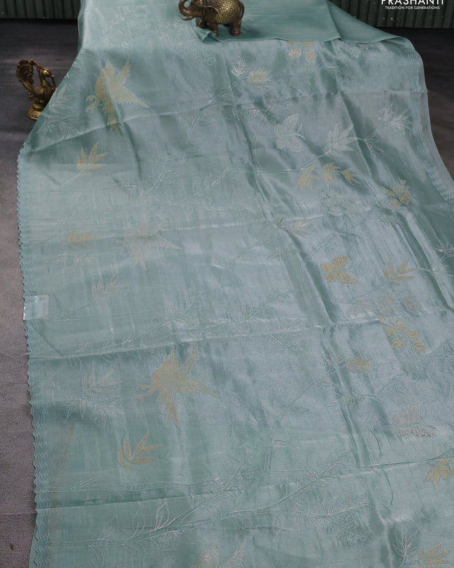 Tissue silk saree teal green with allover pita embroidery work and simple embroidery border