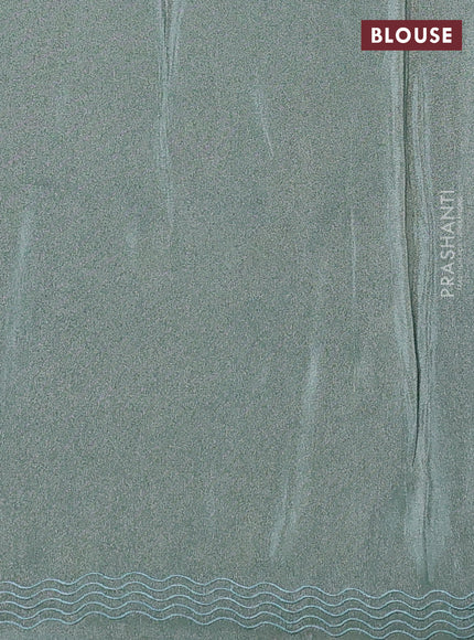 Tissue silk saree teal green with allover pita embroidery work and simple embroidery border