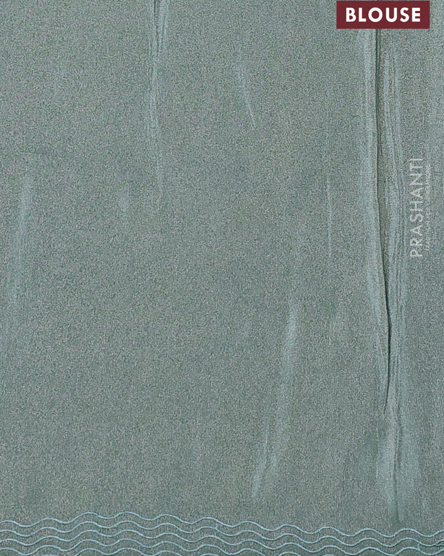 Tissue silk saree teal green with allover pita embroidery work and simple embroidery border