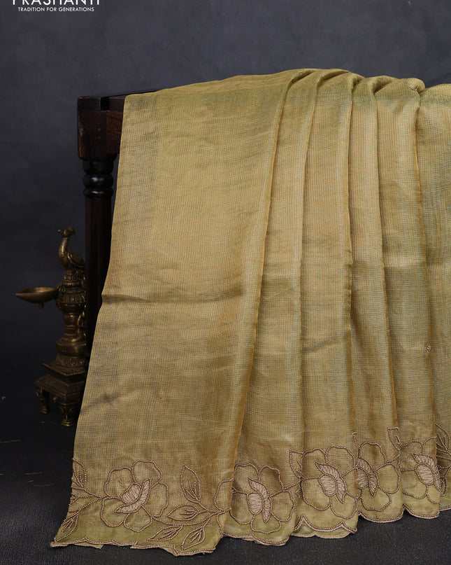 Tissue silk saree light green with plain body and floral beaded embroidery work border