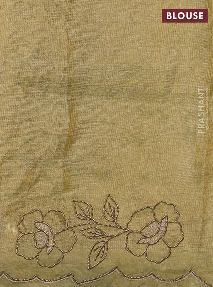 Tissue silk saree light green with plain body and floral beaded embroidery work border