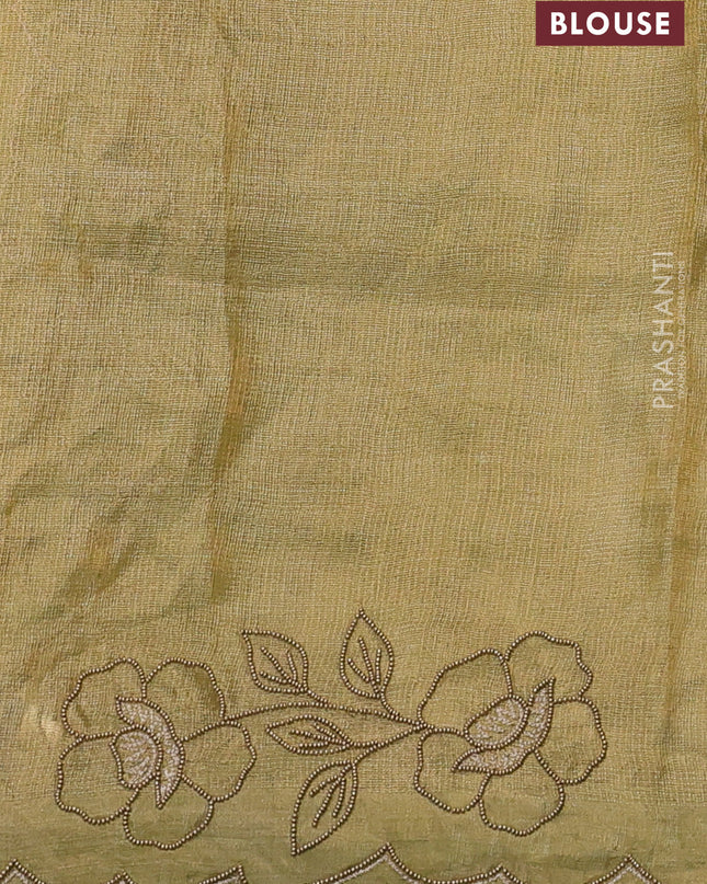 Tissue silk saree light green with plain body and floral beaded embroidery work border