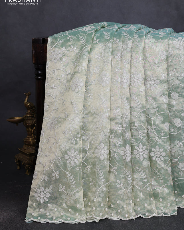 Tissue silk saree pastel green with allover embroidery & sequin work and beaded work border