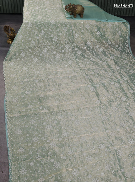 Tissue silk saree pastel green with allover embroidery & sequin work and beaded work border